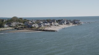 AX91_109 - 4K aerial stock footage of flying by oceanfront and beachfront homes, Fairfield, Connecticut