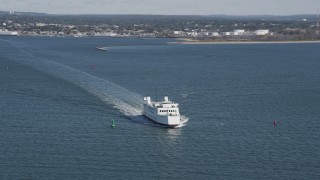 AX91_118 - 4K aerial stock footage of flying by a ferry cruising across the water, Long Island Sound, Connecticut