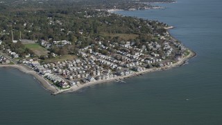 AX91_127 - 4K aerial stock footage video of approaching beachfront homes in Milford, Connecticut