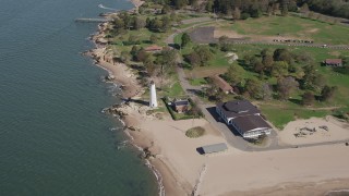 AX91_131 - 4K aerial stock footage of approaching Lighthouse Point in New Haven, Connecticut