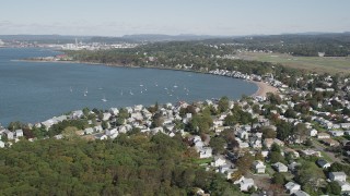 AX91_132 - 4K aerial stock footage of flying by beachfront homes on Morris Cove, New Haven, Connecticut