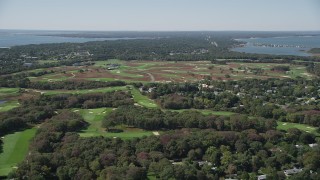 AX91_207 - 4K aerial stock footage of flying by Shinnecock Hills Golf Course, Southampton, New York