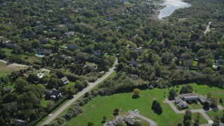 AX91_210 - 4K aerial stock footage of flying by upscale homes in Southampton, New York