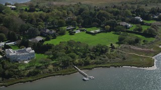 AX91_213 - 4K aerial stock footage of a view of upscale homes near the water, Southampton, New York