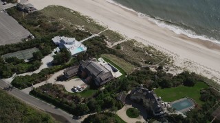 AX91_216 - 4K aerial stock footage of flying over beachfront mansions in Southampton, New York