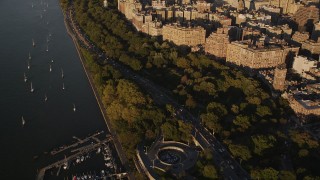 AX93_013 - 4K aerial stock footage Flying by heavy traffic, Henry Hudson Parkway, Upper West Side, New York, sunset