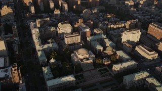 AX93_018 - 4K aerial stock footage Flying by Columbia University, Morningside Heights, New York, New York, sunset