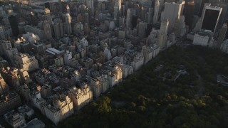 AX93_026 - 4K aerial stock footage Flying by Upper East Side apartments, New York, New York, sunset