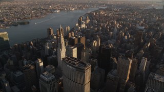 AX93_031 - 4K aerial stock footage Flying by Chrysler Building, Midtown Manhattan, New York, New York, sunset