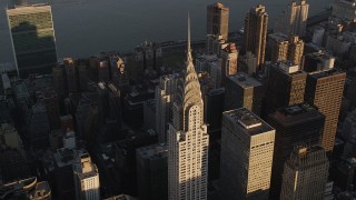 AX93_032 - 4K aerial stock footage Flying by the Chrysler Building, Midtown Manhattan, New York, New York, sunset