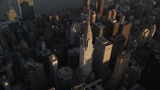 AX93_048 - 4K aerial stock footage Flying by the Chrysler Building, Midtown Manhattan, New York, New York, sunset