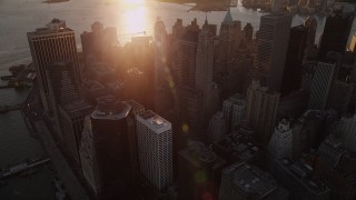 AX93_069 - 4K aerial stock footage Approaching 70 Pine Street, 60 Wall Street, Lower Manhattan, New York, sunset