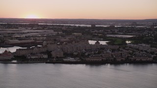 AX93_125 - 4K aerial stock footage of Port Liberte condominiums, townhouses, Jersey City, New Jersey, sunset