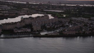 AX93_126 - 4K aerial stock footage of Port Liberte condominiums, townhouses, Jersey City, New Jersey, twilight