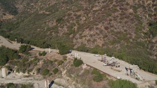 AXSF01_011 - 5K aerial stock footage Flying by oil rigs in the hills, Santa Paula, California