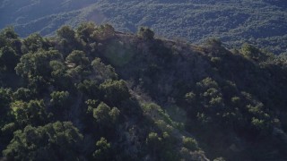 AXSF01_018 - 5K aerial stock footage of approaching hills on the shore and flying over, Lake Casitas, California