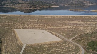 AXSF01_020 - 5K aerial stock footage of approach and pan across the Casitas Dam at Lake Casitas, California