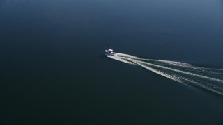 AXSF01_023 - 5K aerial stock footage tracking a small boat, Lake Casitas, Ventura, California
