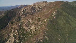 AXSF01_030 - 5K aerial stock footage of approaching the scarred sides of mountains, Santa Ynez Mountains, California