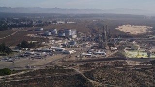 AXSF02_017 - 5K aerial stock footage tilt from Pismo Dunes, reveal Phillips 66 Company Santa Maria Refinery, Arroyo Grande, California