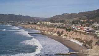 AXSF02_034 - 5K aerial stock footage flyby and pan across oceanfront homes on coastal cliffs, Shell Beach, California