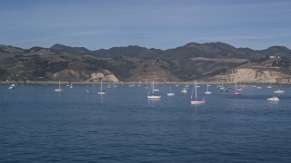 AXSF02_041 - 5K aerial stock footage of flying low by sailboats in San Luis Obispo Bay, Avila Beach, California