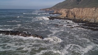 AXSF02_053 - 5K aerial stock footage of approaching coastal cliffs, rock formations, Avila Beach, California
