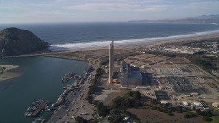 AXSF03_008 - 5K aerial stock footage of the Dynegy Power Plant with smoke stacks, reveal Morro Rock, Morro Bay, California