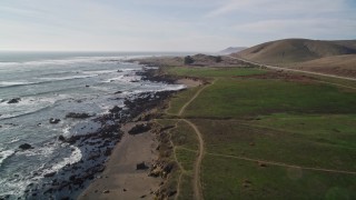 AXSF03_011 - 5K aerial stock footage of following the coastline near Highway 1, Estero Bay, California