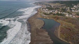 AXSF03_028 - 5K aerial stock footage tilt from oceanfront homes to reveal Moon Stone Beach, Cambria, California