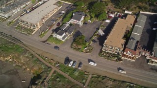AXSF03_029 - 5K aerial stock footage of oceanfront hotels on Moonstone Beach Drive, Cambria, California