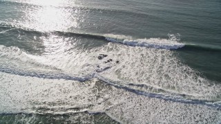 AXSF03_032 - 5K aerial stock footage of flying by ocean waves, Cambria, California