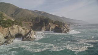 AXSF03_094 - 5K aerial stock footage of approaching McWay Falls and coastal cliffs, Big Sur, California