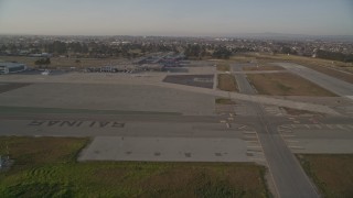 AXSF03_116 - 5K aerial stock footage of landing at the Salinas Municipal Airport, Salinas, California