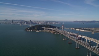 AXSF05_006 - 5K aerial stock footage approach Bay Bridge, Yerba Buena Island, with view of Downtown San Francisco, California
