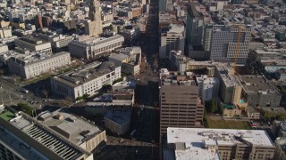 AXSF05_014 - 5K aerial stock footage follow Market Street, tilt to reveal skyscrapers, Downtown San Francisco, California