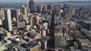 AXSF05_015 - 5K aerial stock footage tilt from Market Street, and reveal skyscrapers in Downtown San Francisco, California