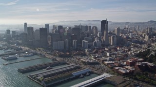 AXSF05_018 - 5K aerial stock footage of reverse view of skyscrapers, reveal North Beach and Coit Tower, Downtown San Francisco, California