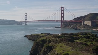 AXSF05_038 - 5K aerial stock footage tilting up from San Francisco Bay to reveal Golden Gate Bridge, San Francisco, California