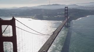 AXSF05_039 - 5K aerial stock footage flying by Golden Gate Bridge, reveal the downtown skyline in distance, San Francisco, California