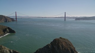 AXSF05_040 - 5K aerial stock footage of flying over Marin Headlands revealing Golden Gate Bridge, San Francisco, California