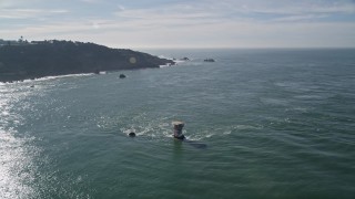 AXSF05_048 - 5K aerial stock footage flying over Miles Rock Light, approaching end of Seacliff, San Francisco, California