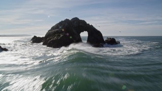 AXSF05_050 - 5K aerial stock footage tilt from the Pacific Ocean revealing Seal Rocks, San Francisco, California