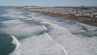 AXSF05_052 - 5K aerial stock footage fly over waves rolling into the Outer Sunset District community, San Francisco, California