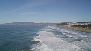 AXSF05_054 - 5K aerial stock footage waves crashing near Ocean Beach, Outer Sunset District, California