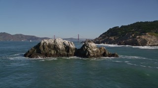 AXSF05_056 - 5K aerial stock footage approach Seal Rocks, reveal the Golden Gate Bridge, San Francisco, California
