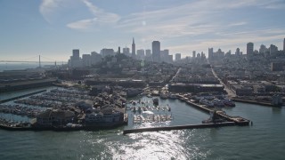 AXSF05_065 - 5K aerial stock footage Flyby Pier 39 and marina, San Francisco skyline in background, San Francisco, California