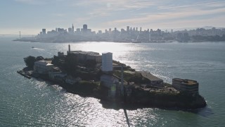 AXSF05_068 - 5K aerial stock footage orbit famous Alcatraz, reveal city skyline, Downtown San Francisco, California