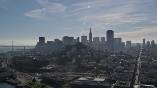 AXSF05_070 - 5K aerial stock footage fly over iconic Pier 39, Coit Tower, toward views of skyline, Downtown San Francisco, California