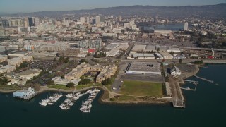 AXSF05_086 - 5K aerial stock footage flyby waterfront apartment buildings, marinas, KTVU Television/FOX 2 building, Oakland, California